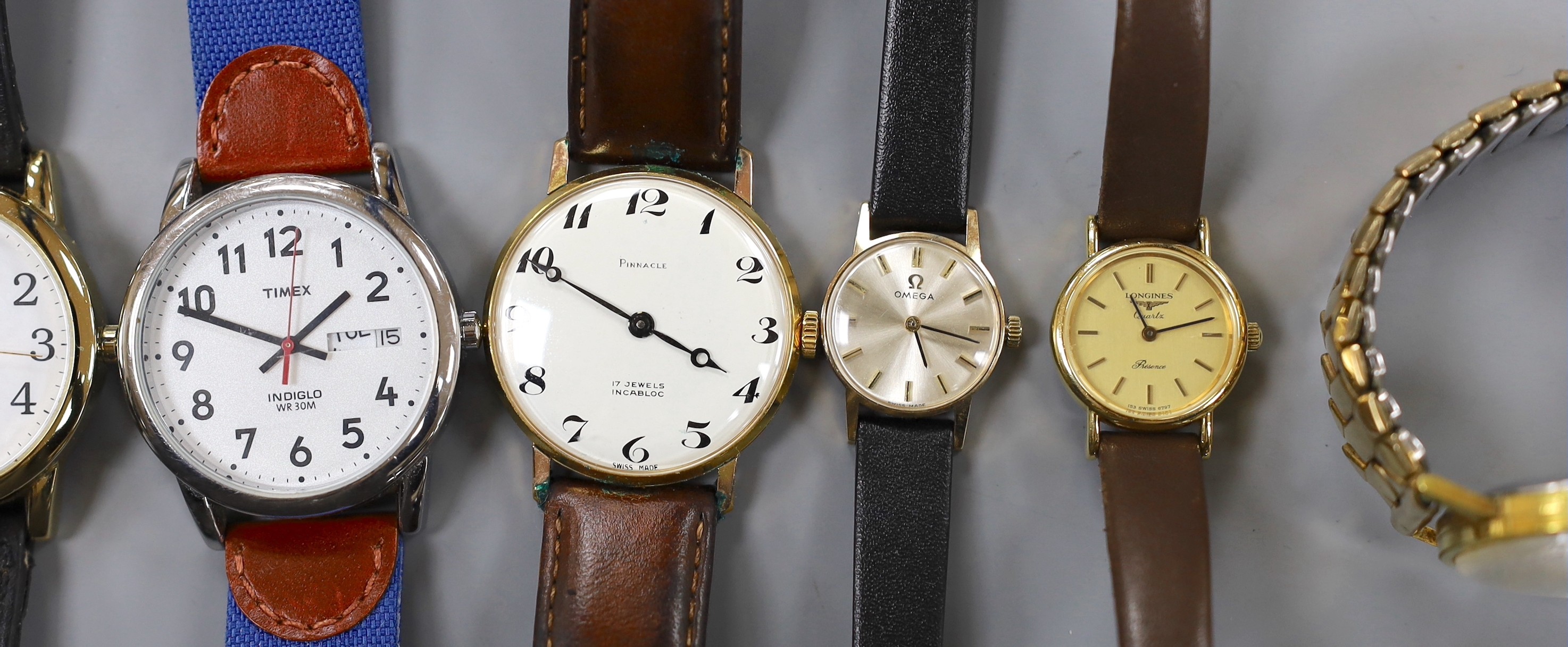 A lady's yellow metal Omega manual wind wrist watch and a group of assorted wrist watch including Lorus, Timex etc.